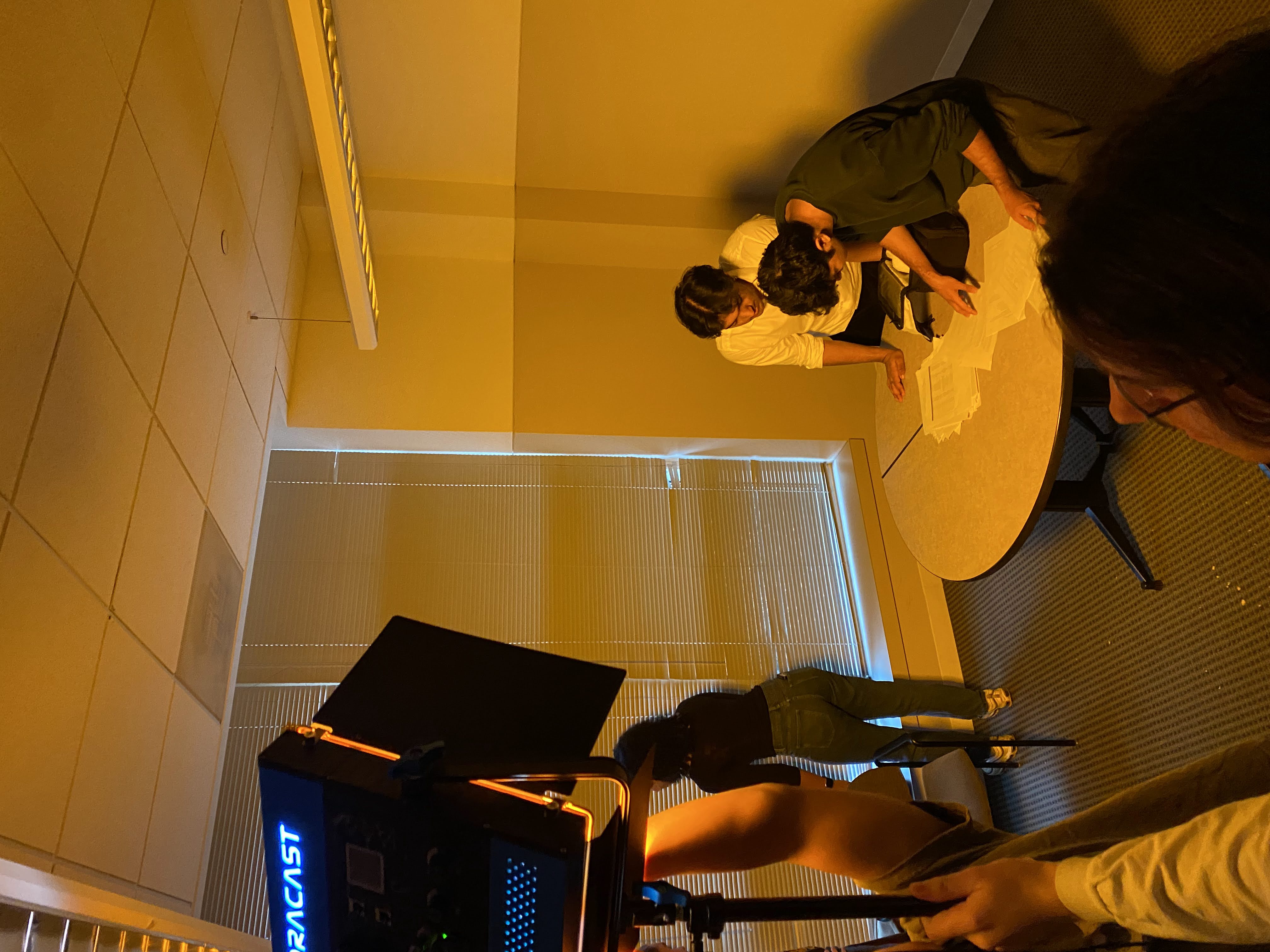 REDLIST film shoot — scene setup around a table